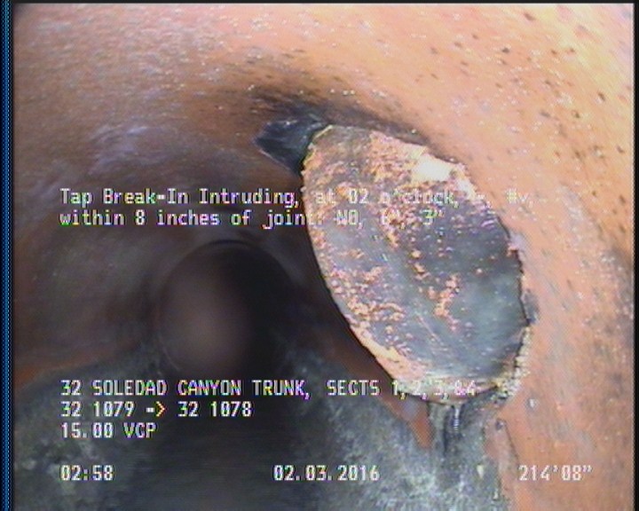 Tap Break-In Intruding, at 02 o'clock, -, #v, within 8 inches of joint: NO, 6", 3"