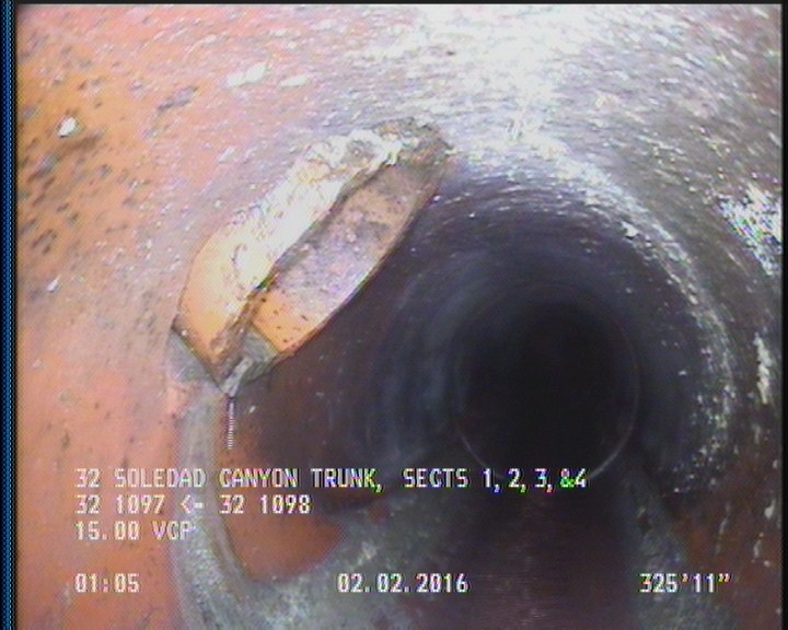 Tap Break-In Intruding, at 10 o'clock, -, #v, within 8 inches of joint: NO, 6", 1"