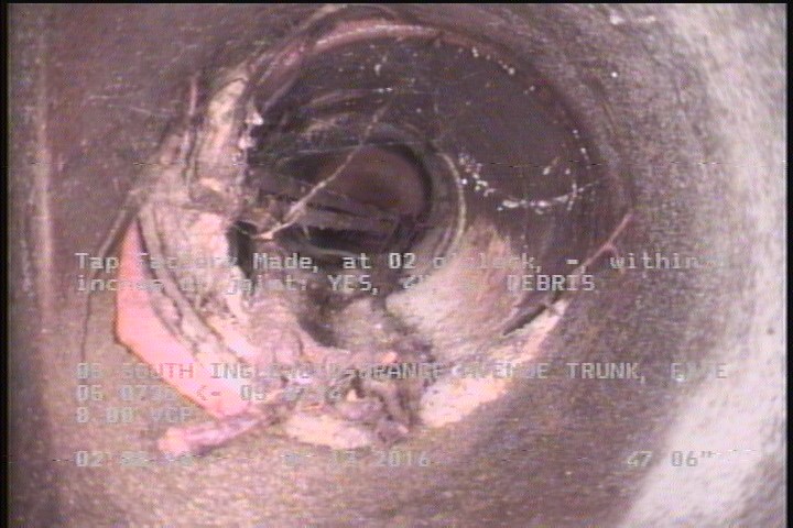 Tap Factory Made, at 02 o'clock, -, within 8 inches of joint: YES, 4" - W/ DEBRIS