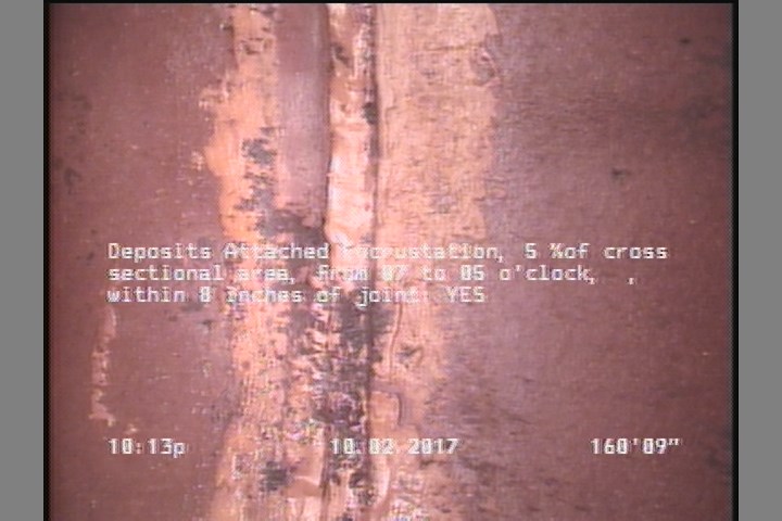 Deposits Attached Encrustation, 5 %of cross sectional area, from 07 to 05 o'clock, , within 8 inches of joint: YES
