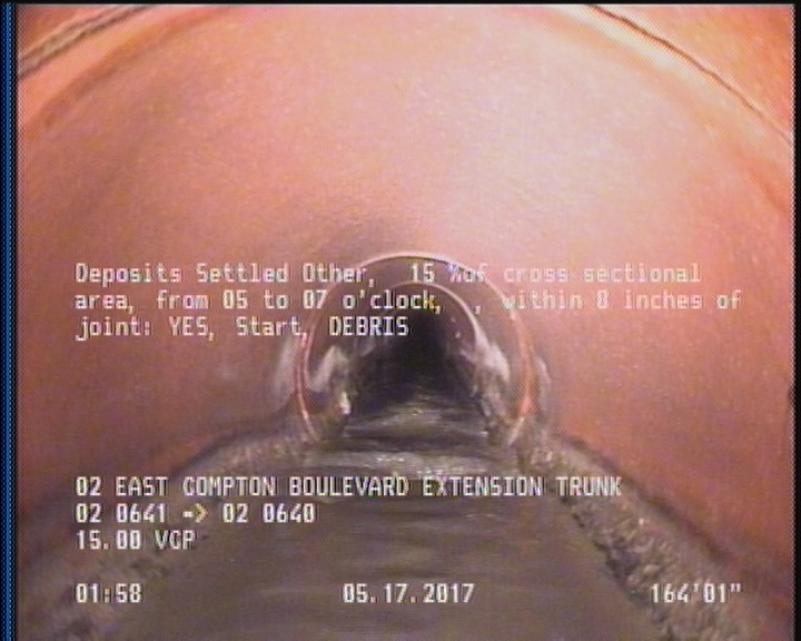 Deposits Settled Other, 15 %of cross sectional area, from 05 to 07 o'clock, , within 8 inches of joint: YES, Start - DEBRIS
