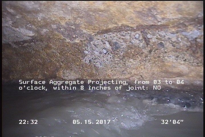 Surface Aggregate Projecting, from 03 to 04 o'clock, within 8 inches of joint: NO