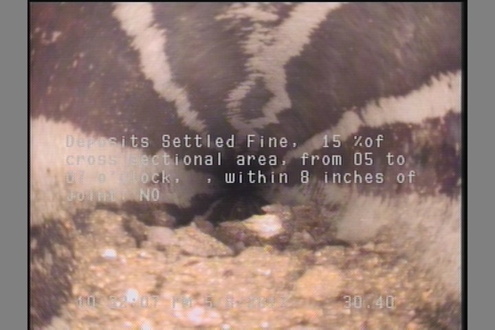 Deposits Settled Fine, 15 %of cross sectional area, from 05 to 07 o'clock, , within 8 inches of joint: NO