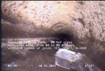 Deposits Settled Fine, 20 %of cross sectional area, from 04 to 08 o'clock, , within 8 inches of joint: YES, Start - SLUDGE