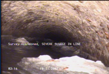Survey Abandoned - SEVERE SLUDGE IN LINE