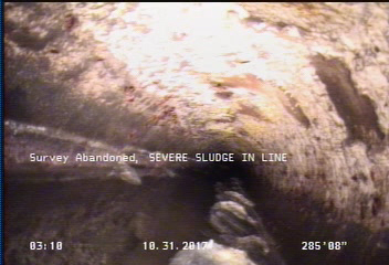 Survey Abandoned - SEVERE SLUDGE IN LINE