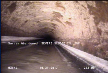 Survey Abandoned - SEVERE SLUDGE IN LINE