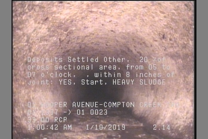 Deposits Settled Other, 20 %of cross sectional area, from 05 to 07 o'clock, , within 8 inches of joint: YES, Start - HEAVY SLUDGE