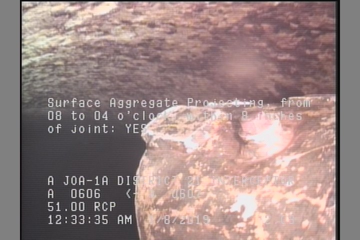 Surface Aggregate Projecting, from 08 to 04 o'clock, within 8 inches of joint: YES
