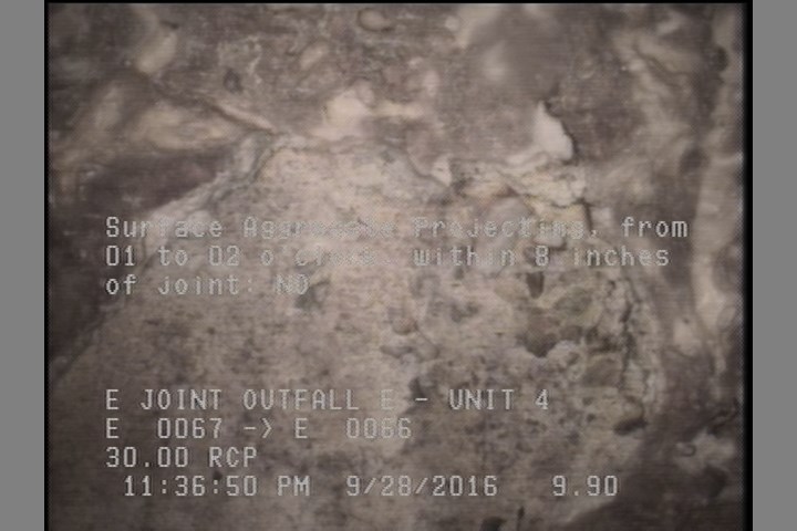 Surface Aggregate Projecting, from 01 to 02 o'clock, within 8 inches of joint: NO