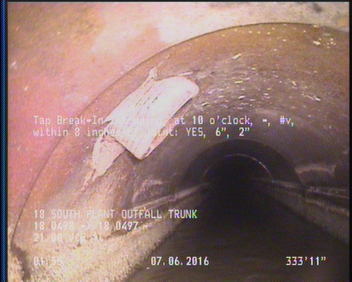 Tap Break-In Intruding, at 10 o'clock, -, #v, within 8 inches of joint: YES, 6", 2"