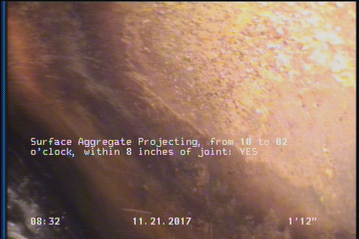 Surface Aggregate Projecting, from 10 to 02 o'clock, within 8 inches of joint: YES