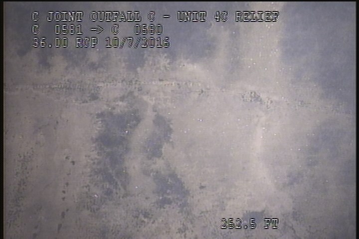 General Observation - THIN WHITE BUILD-UP ON LINER