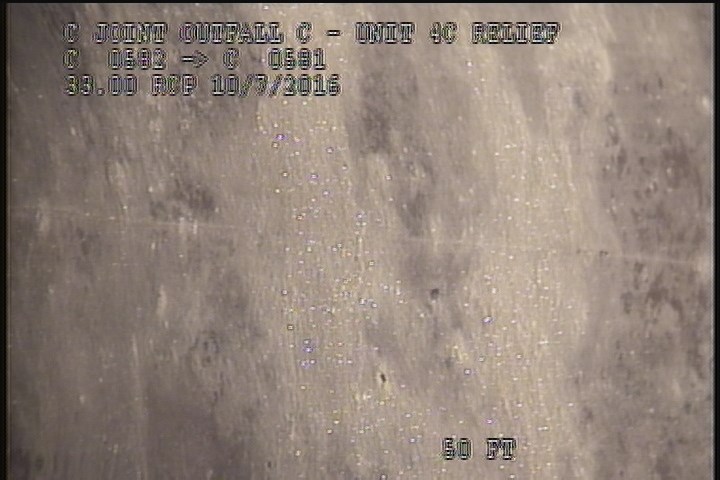 General Observation - THIN WHITE BUILD-UP ON LINER
