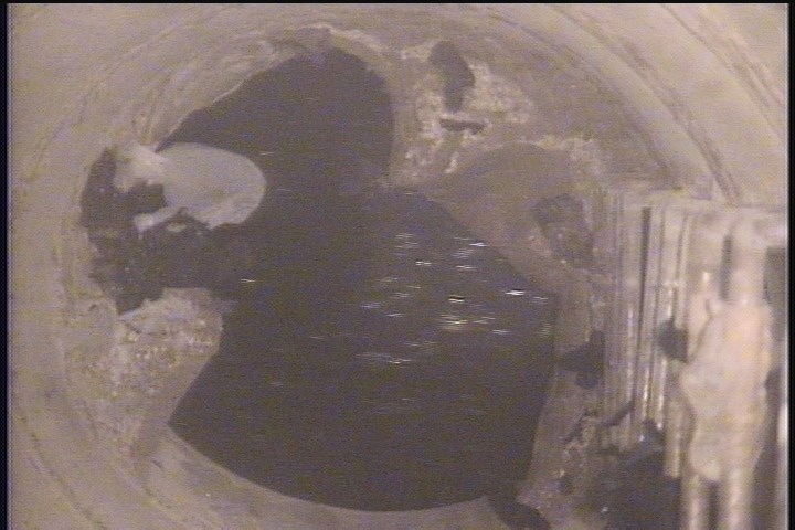 Lining Failure Detached, from 04 to 08 o'clock, within 8 inches of joint: NO - LINER PEELING AWAY END OF MH STACK