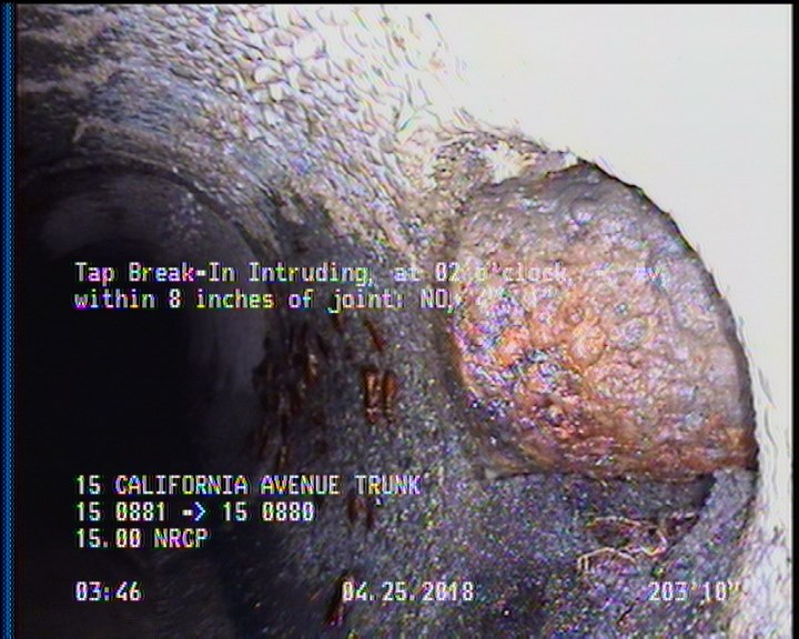 Tap Break-In Intruding, at 02 o'clock, -, #v, within 8 inches of joint: NO, 4", 1"