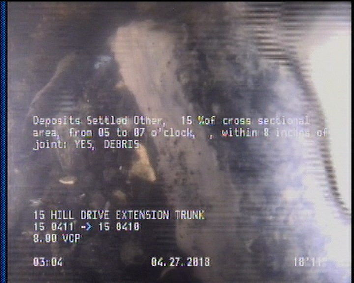 Deposits Settled Other, 15 %of cross sectional area, from 05 to 07 o'clock, , within 8 inches of joint: YES - DEBRIS