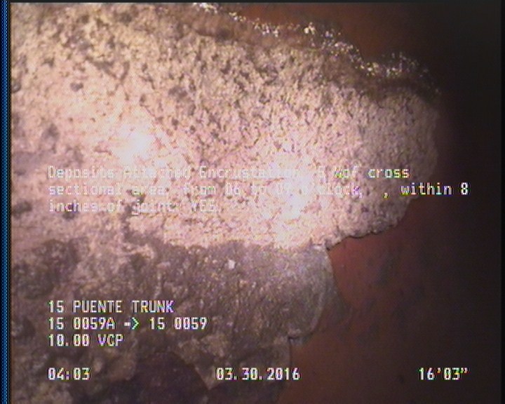 Deposits Attached Encrustation, 5 %of cross sectional area, from 06 to 09 o'clock, , within 8 inches of joint: YES