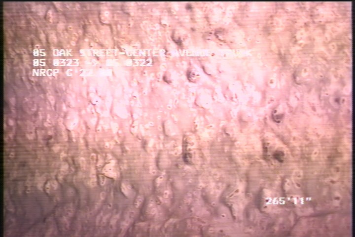 Surface Aggregate Projecting, from 07 to 05 o'clock, within 8 inches of joint: NO - SEVERE AGG UNDER MAG COAT