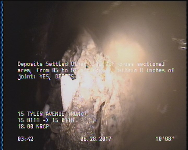 Deposits Settled Other, 15 %of cross sectional area, from 05 to 07 o'clock, , within 8 inches of joint: YES - DEBRIS