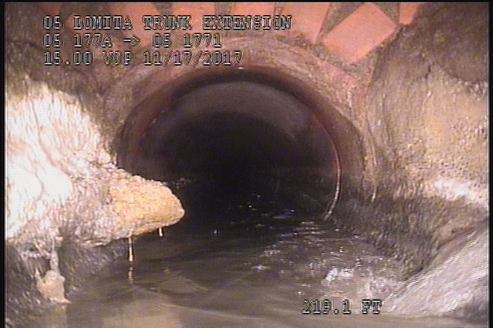 Deposits Attached Grease, 10 %of cross sectional area, from 08 to 09 o'clock, , within 8 inches of joint: NO - INSIDE MH