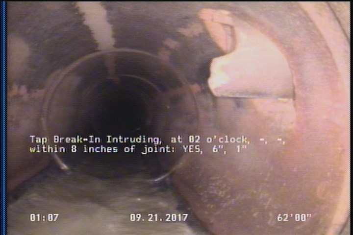 Tap Break-In Intruding, at 02 o'clock, -, -, within 8 inches of joint: YES, 6", 1"