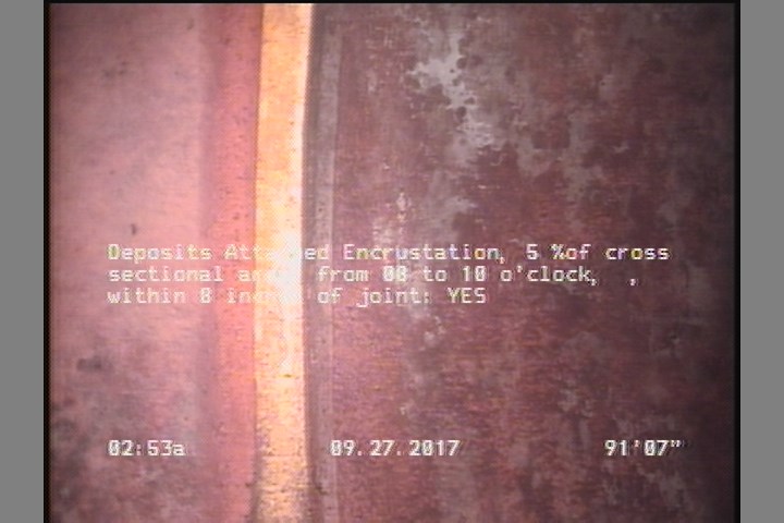 Deposits Attached Encrustation, 5 %of cross sectional area, from 08 to 10 o'clock, , within 8 inches of joint: YES