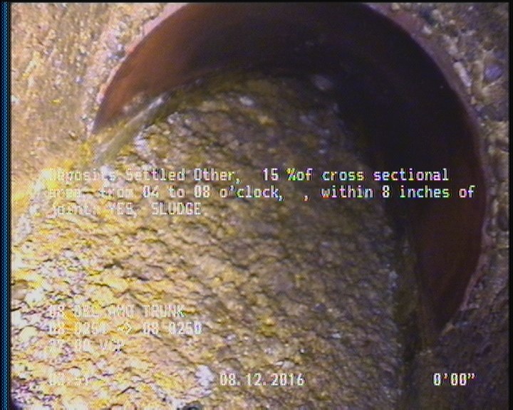 Deposits Settled Other, 15 %of cross sectional area, from 04 to 08 o'clock, , within 8 inches of joint: YES - SLUDGE