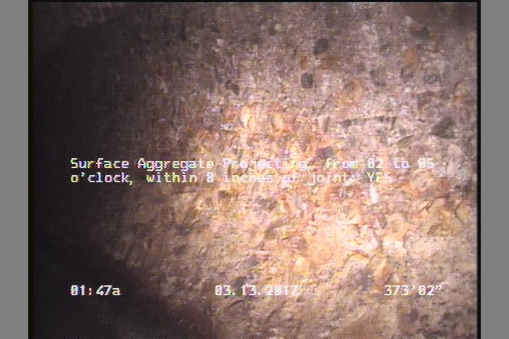 Surface Aggregate Projecting, from 02 to 05 o'clock, within 8 inches of joint: YES