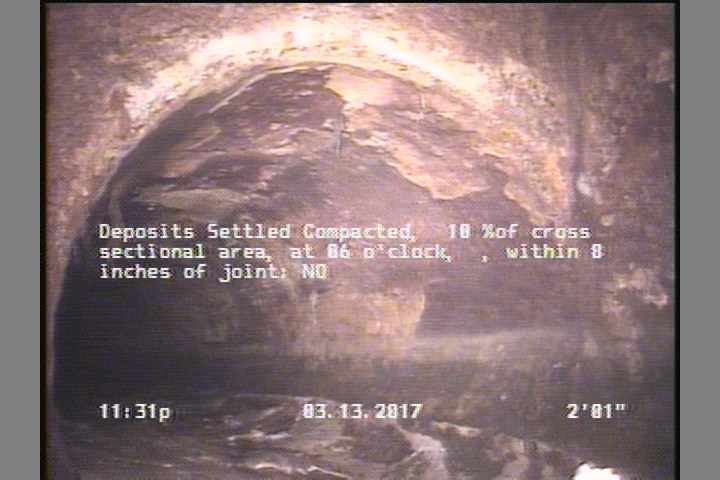Deposits Settled Compacted, 10 %of cross sectional area, at 06 o'clock, , within 8 inches of joint: NO