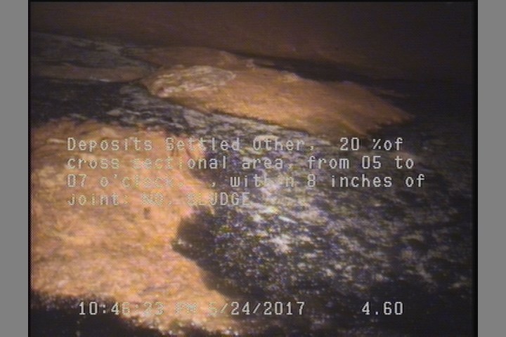 Deposits Settled Other, 20 %of cross sectional area, from 05 to 07 o'clock, , within 8 inches of joint: NO - SLUDGE