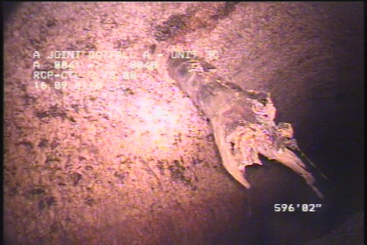 Obstacles Other, 10 %of cross sectional area, from 09 to 11 o'clock - POSSIBLY RAGS CAUGHT ON BROKEN REBAR