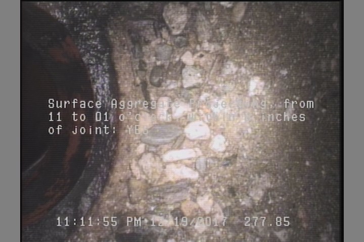 Surface Aggregate Projecting, from 11 to 01 o'clock, within 8 inches of joint: YES