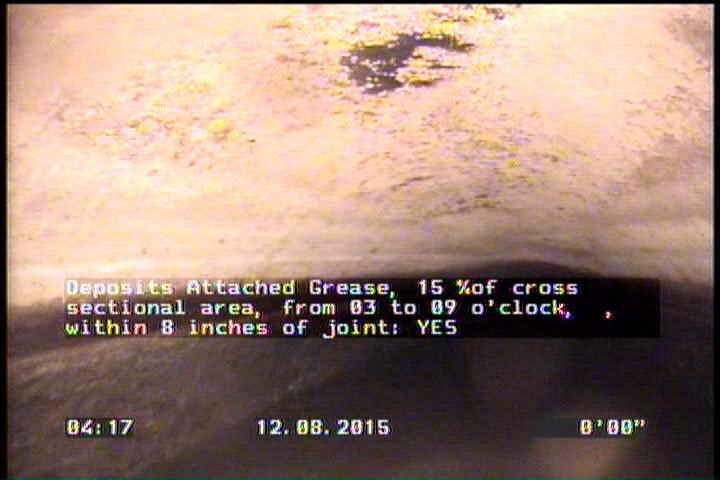 Deposits Attached Grease, 15 %of cross sectional area, from 03 to 09 o'clock, , within 8 inches of joint: YES