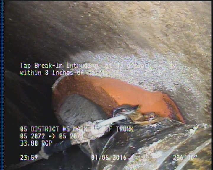Tap Break-In Intruding, at 03 o'clock, -, #v, within 8 inches of joint: YES, 8", 2", 6"