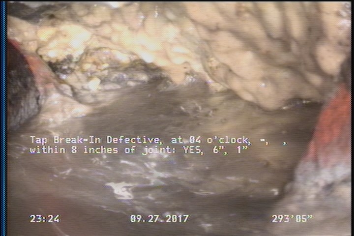 Tap Break-In Defective, at 04 o'clock, -, , within 8 inches of joint: YES, 6", 1" - TAPE AND DEBRIS INTRUDING