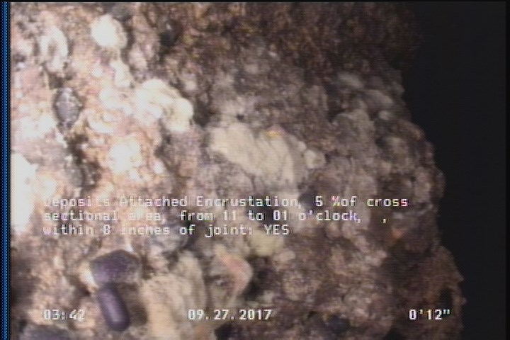Deposits Attached Encrustation, 5 %of cross sectional area, from 11 to 01 o'clock, , within 8 inches of joint: YES