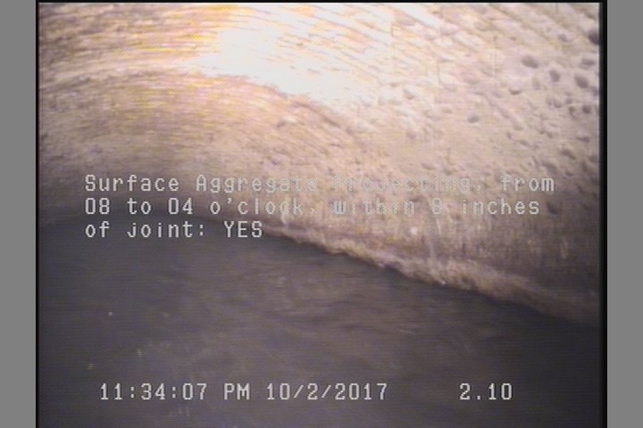 Surface Aggregate Projecting, from 08 to 04 o'clock, within 8 inches of joint: YES