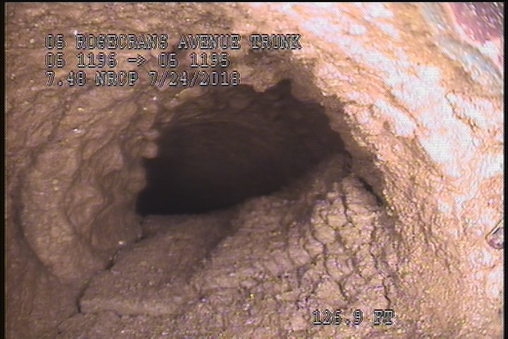 Tap Factory Made Defective, at 03 o'clock, -, within 8 inches of joint: YES, 4" - 50% GREASE/LATERAL
