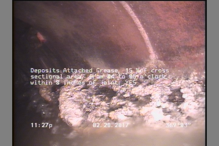 Deposits Attached Grease, 15 %of cross sectional area, from 04 to 05 o'clock, , within 8 inches of joint: YES