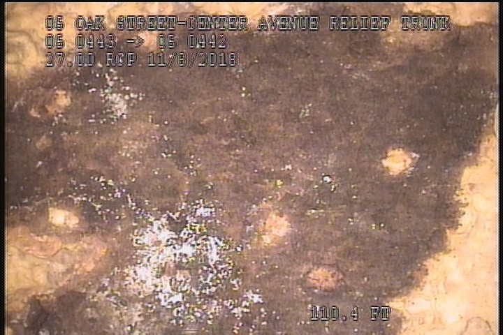 Surface Spalling, from 02 to 03 o'clock, within 8 inches of joint: NO - FLAKING CONCRERTE UNDER MAG COAT