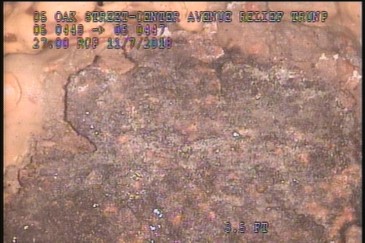 Surface Spalling, from 12 to 02 o'clock, within 8 inches of joint: NO - FLAKING CONCRETE UNDER MAG COAT
