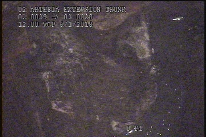 Deposits Attached Grease, 25 %of cross sectional area, from 04 to 08 o'clock, , within 8 inches of joint: YES - BOTTOM OF MH