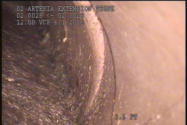 Broken, from 12 to 03 o'clock, within 8 inches of joint: YES - SLIGHT FRACTURE