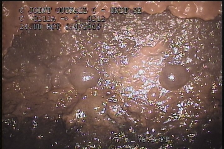 Surface Spalling, from 02 to 04 o'clock, within 8 inches of joint: NO - BLISTERING CONCRETE