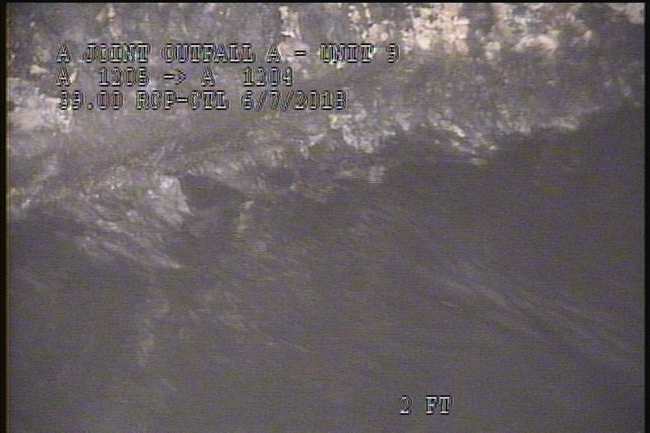 Deposits Settled Other, 5 %of cross sectional area, from 07 to 08 o'clock, , within 8 inches of joint: NO - UNKNOWN DEBRIS IN THE LINE