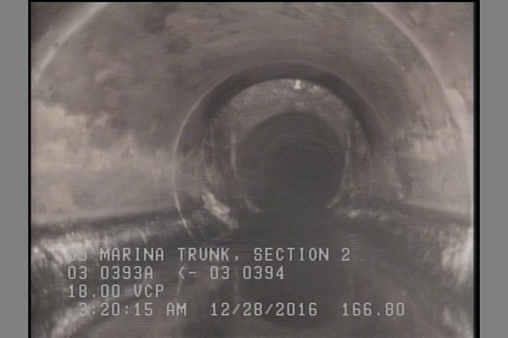 Obstacles Other, 20 %of cross sectional area, from 04 to 08 o'clock - DEBRIS NOT VISIBLE POSSIBLE 8 FT AWAY FROM MH