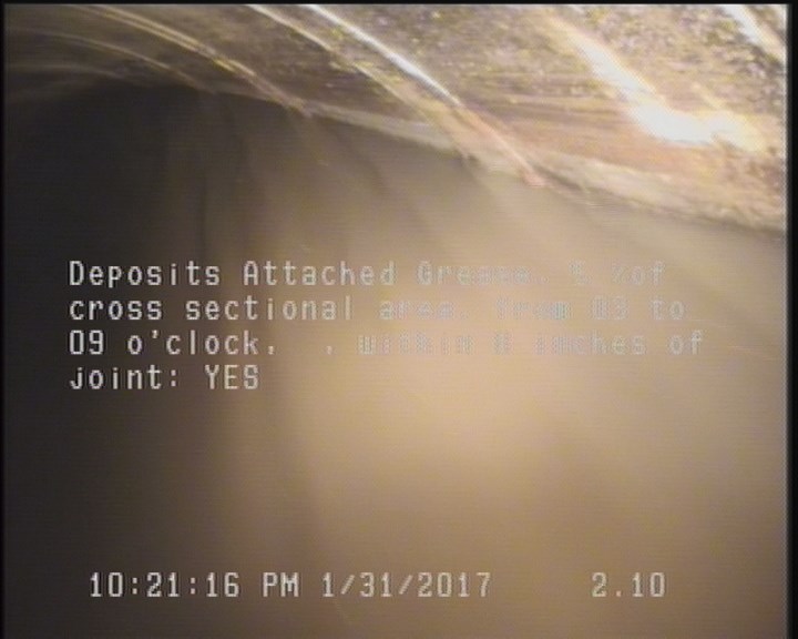 Deposits Attached Grease, 5 %of cross sectional area, from 03 to 09 o'clock, , within 8 inches of joint: YES