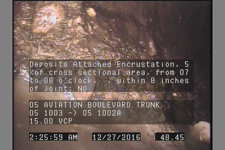 Deposits Attached Encrustation, 5 %of cross sectional area, from 07 to 08 o'clock, , within 8 inches of joint: NO