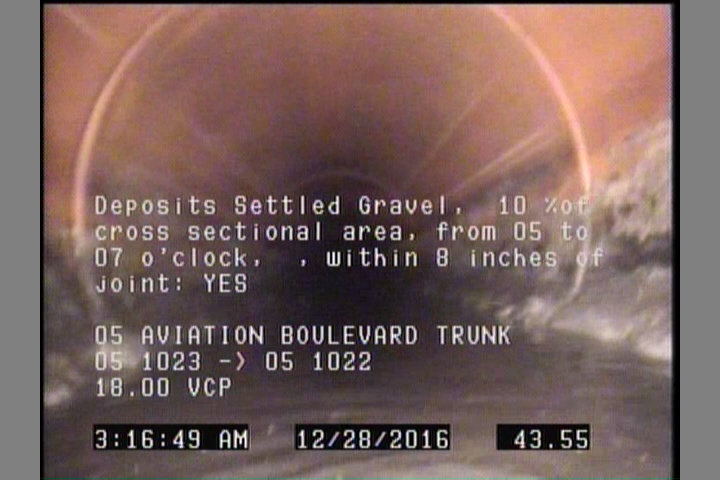Deposits Settled Gravel, 10 %of cross sectional area, from 05 to 07 o'clock, , within 8 inches of joint: YES